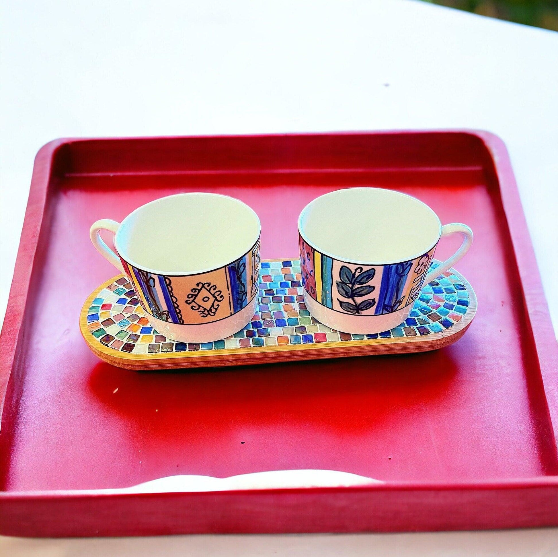 Ceramic trivet, spoon rest, and plant stand with decorative design, ideal for kitchen or table use.