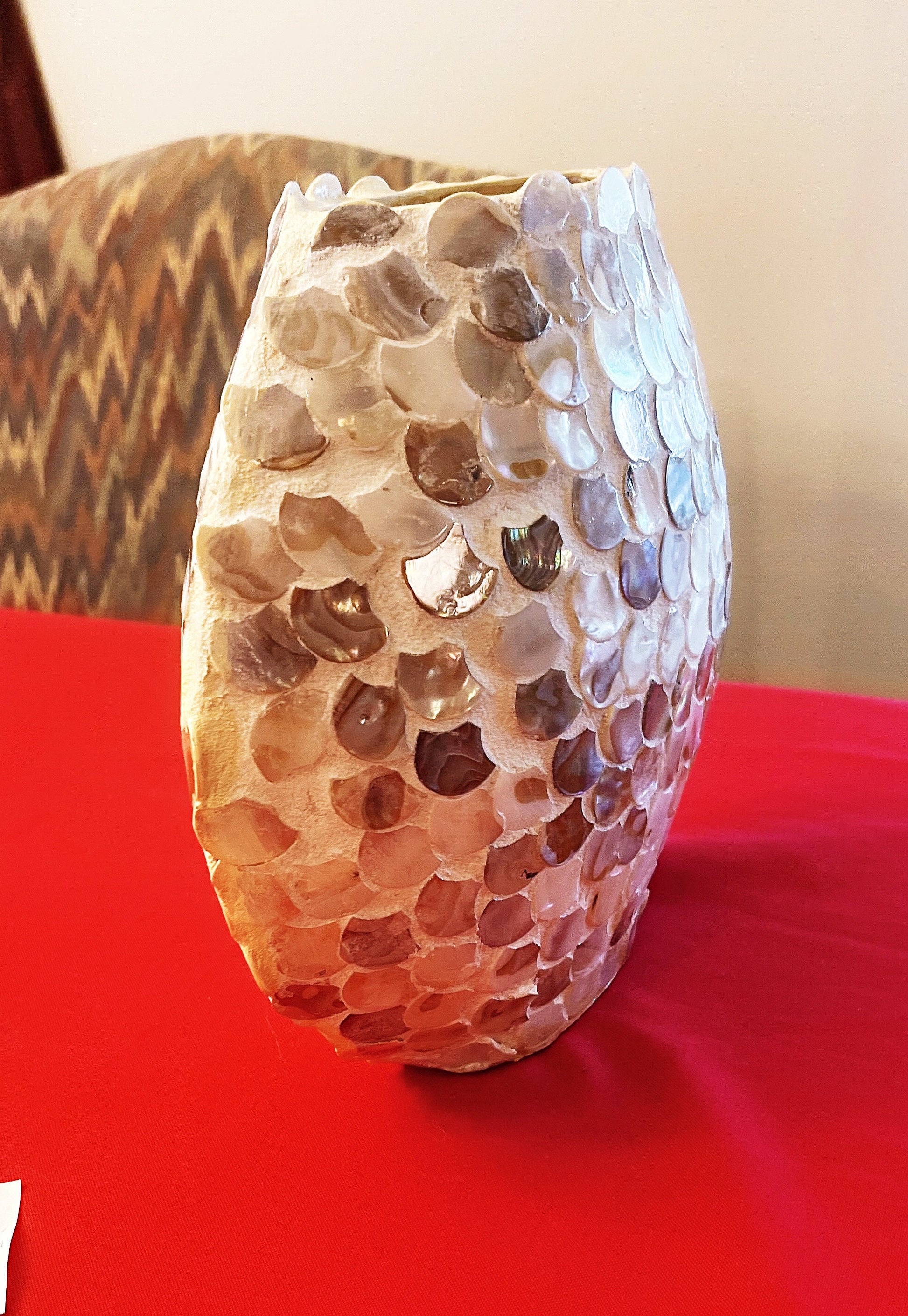Handcrafted mother of pearl mosaic oval vase with intricate design and glossy finish, ideal for elegant home decor.