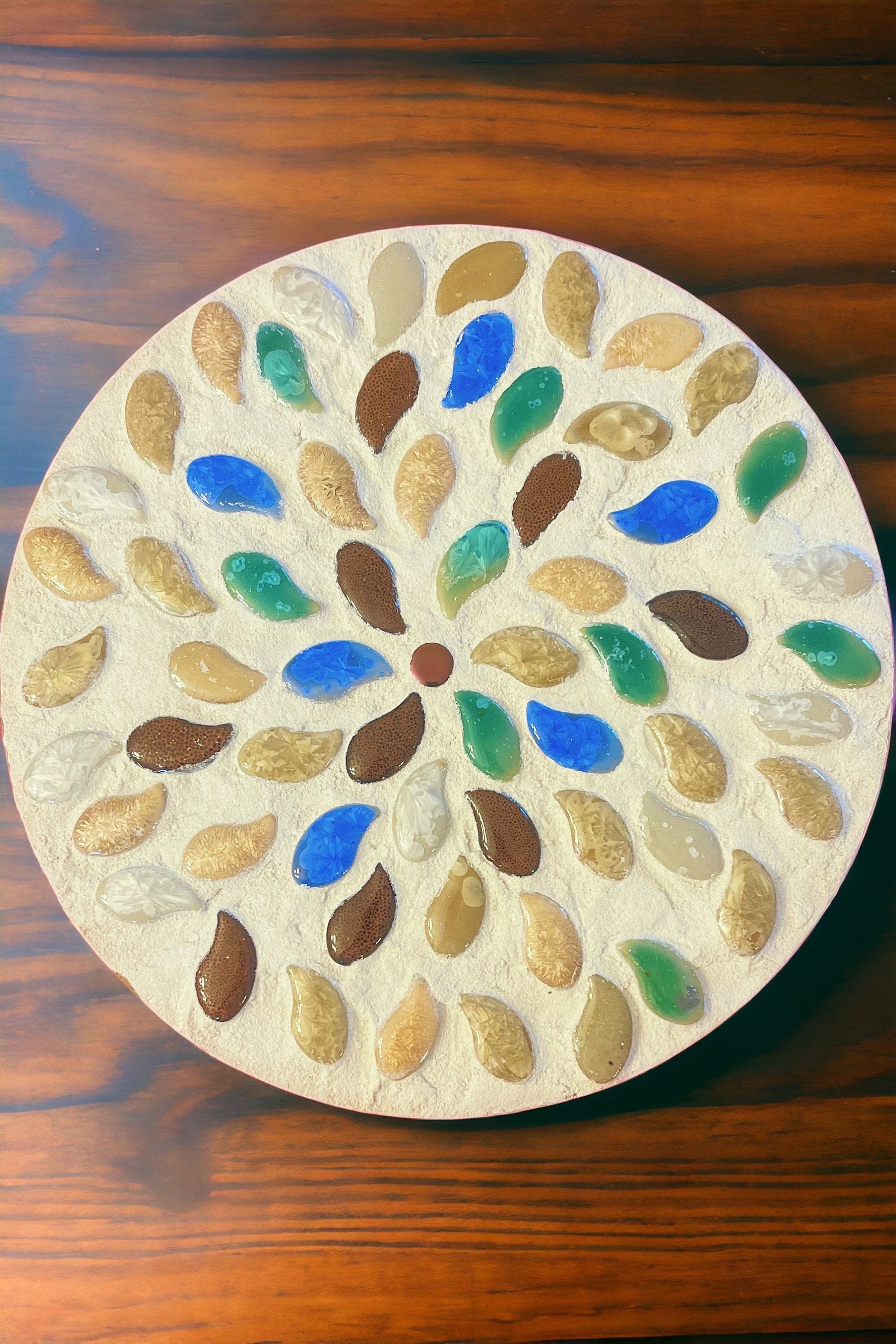 Handcrafted earth tone mosaic plant stand showcasing intricate tile patterns and sturdy wooden construction.