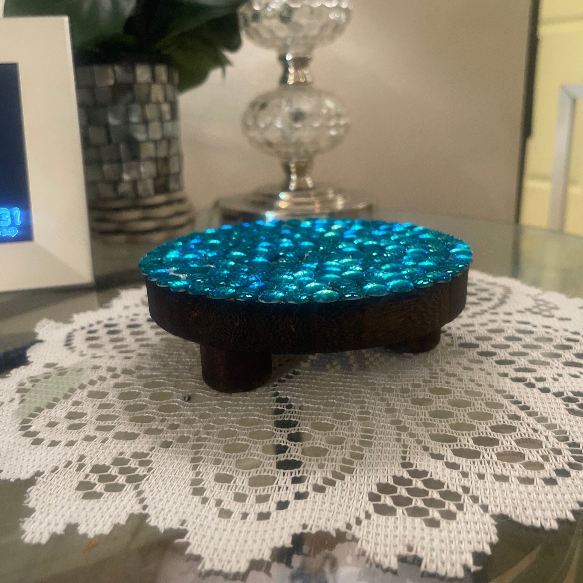 Artisanal turquoise cabochon mosaic plant stand by Miss Bette's Creations with colorful, intricate tile design and sturdy support.