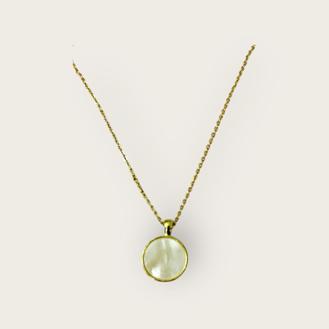 Iridescent shell resin circle pendant featuring shimmering, colorful surface on a jewelry chain.