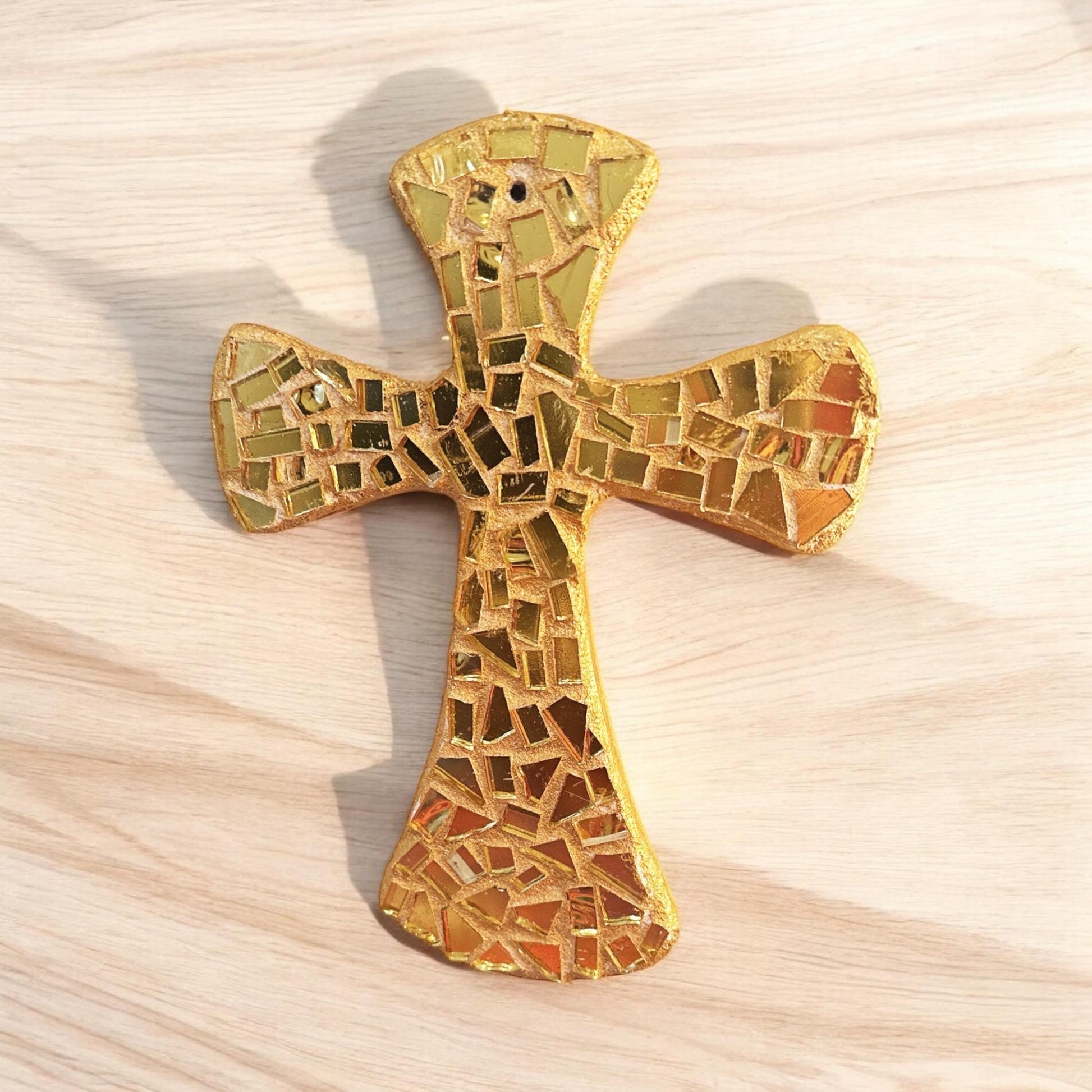 Handcrafted gold mosaic cross by Miss Bette's Creations, featuring intricate mosaic details and a polished finish.