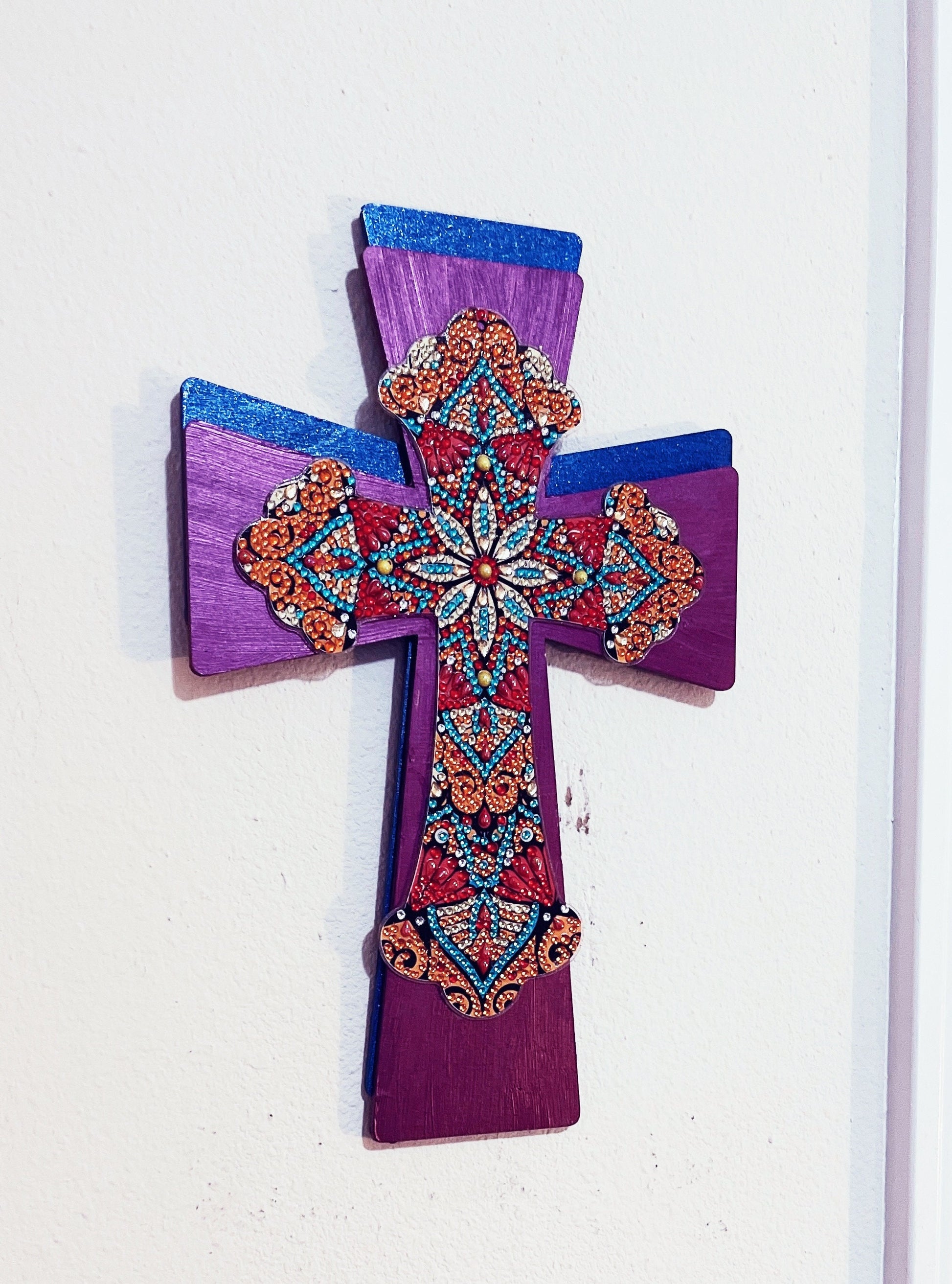 Handmade Christian cross wall hanging with decorative details, crafted for religious home decor and wall display.