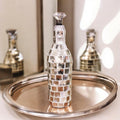 Silver mirrored mosaic wine decanter with intricate mosaic design, elegant shape, and reflective surface, perfect for wine serving.