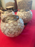 Handcrafted scalloped Capiz shell globe vase with intricate shell details, perfect for elegant home decor.