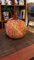 Handmade decorative fall pumpkin from My Store with textured orange surface and green stem, perfect for autumn home decor.