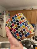 Colorful rainbow mosaic planter made of handcrafted ceramic with vibrant, intricate patterns, perfect for indoor or outdoor plants.
