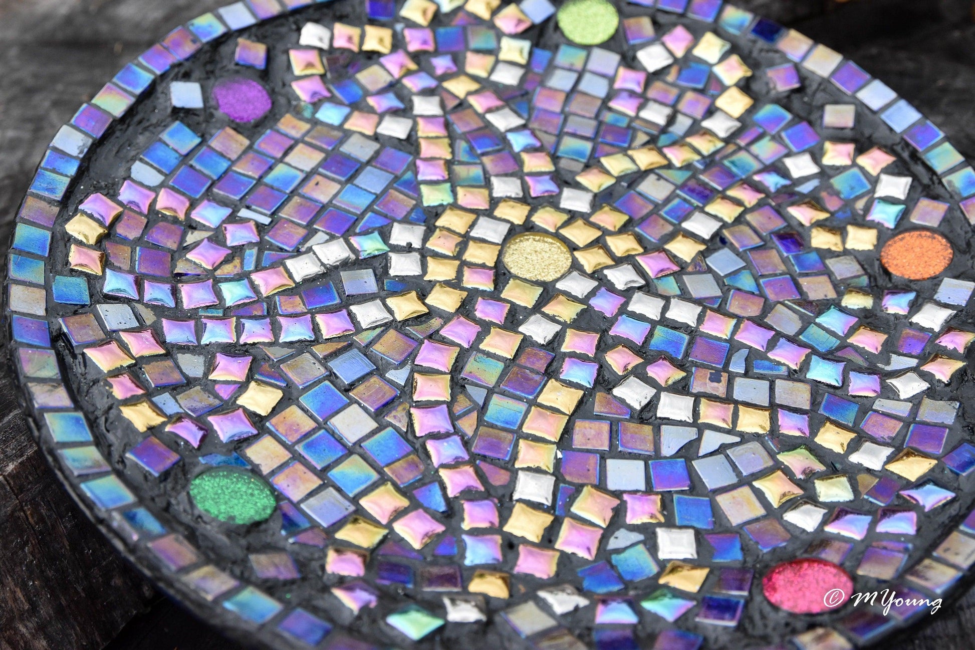Original handcrafted iridescent mosaic wall art featuring colorful glass pieces in a vibrant, artistic display.