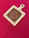 Handcrafted diamond art wood cutting board featuring a detailed floral design, made from polished wood with intricate patterns.