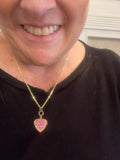 Gold sparkling rose-shaped heart locket with intricate detailing, perfect for jewelry and accessory collections.