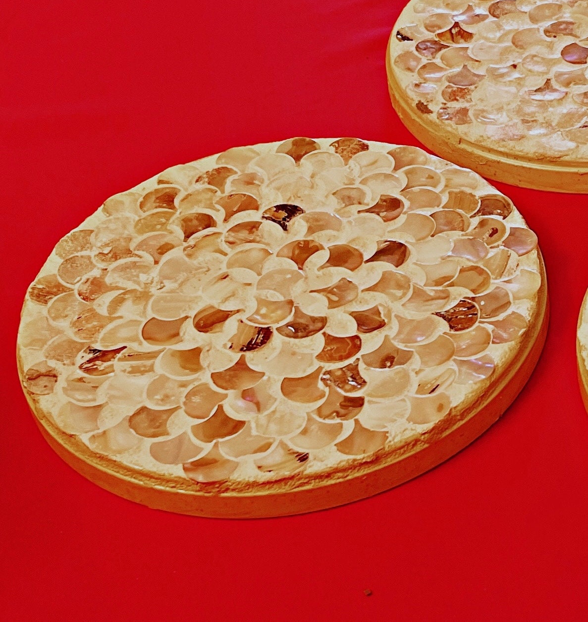 Handmade mother of pearl scallop mosaic decorative stand with intricate shell pattern, ideal for home decor display