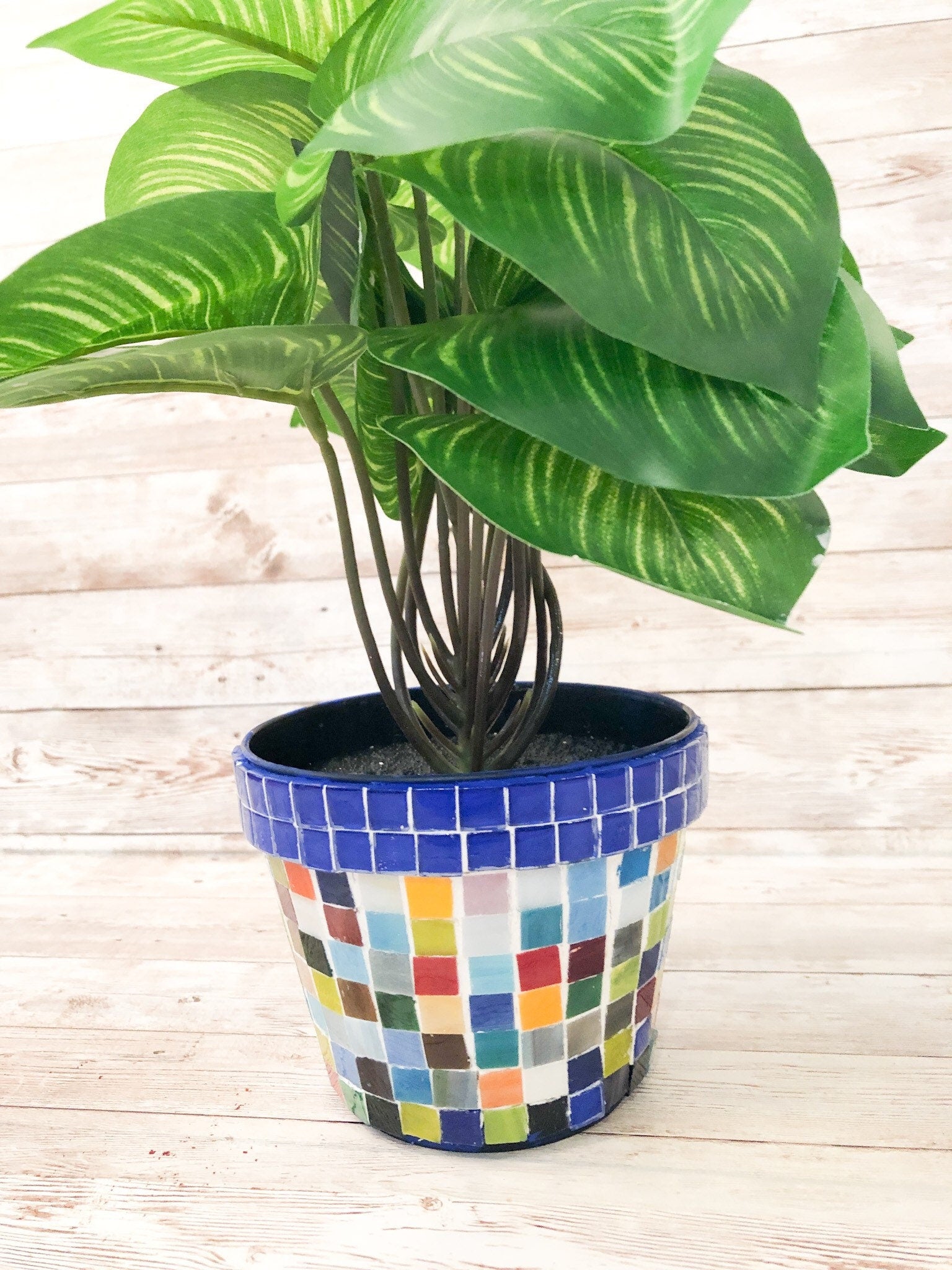 Colorful artisan rainbow mosaic planter with intricate tile designs, ideal for adding vibrant greenery to indoor or outdoor spaces.