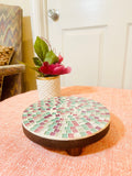 Handcrafted pink and green mosaic plant stand by Miss Bette's Creations, featuring intricate tile patterns and sturdy design.
