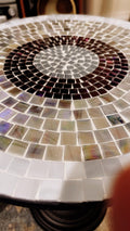 Round side table with iridescent gray and purple mosaic top on black metal base, 15-inch diameter and 20-inch height.