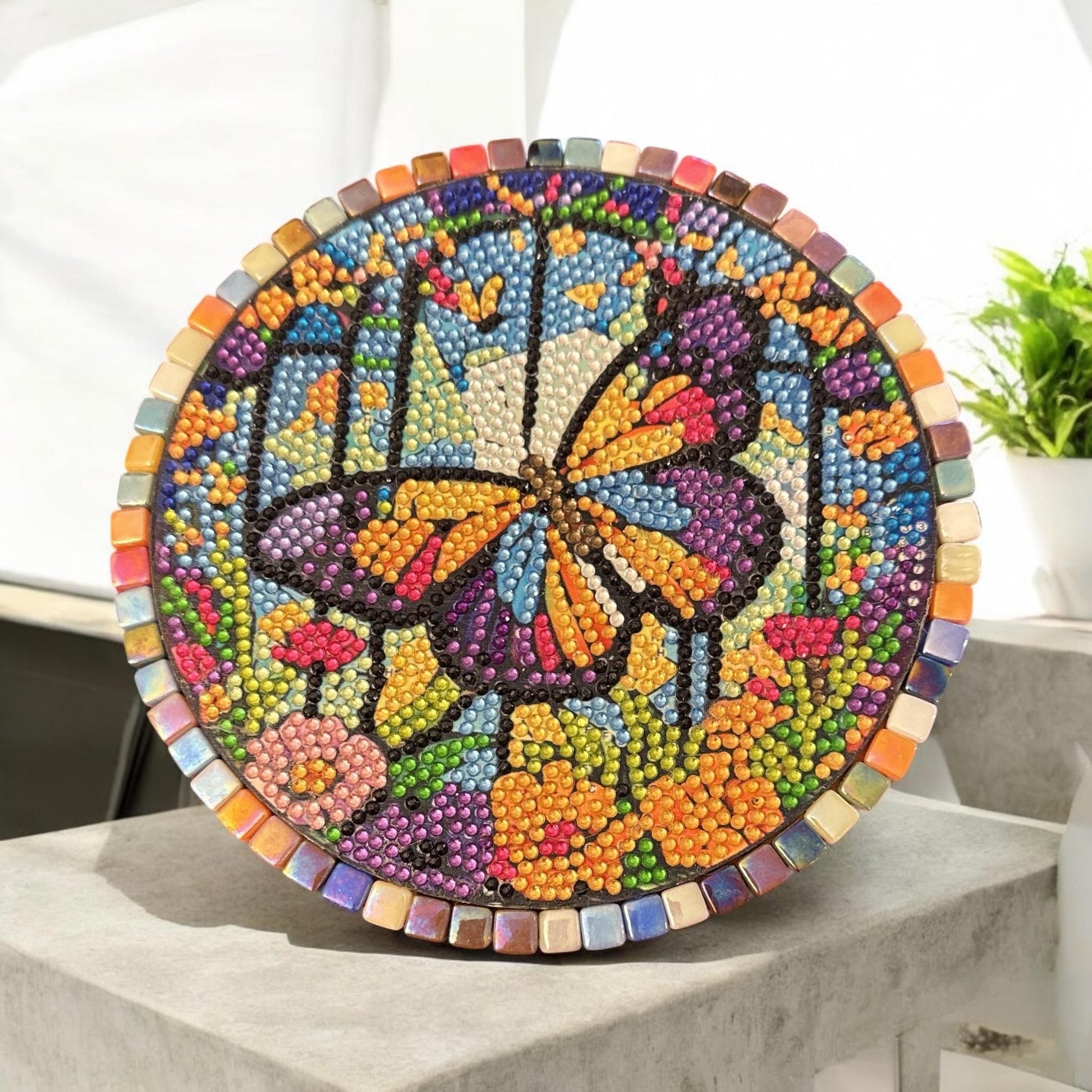 Butterfly crystal mosaic trivet with decorative display featuring colorful glass and intricate design, ideal for kitchen or table decor.