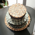 Set of handcrafted metallic mosaic plant stands featuring colorful, intricate designs for indoor or outdoor use.