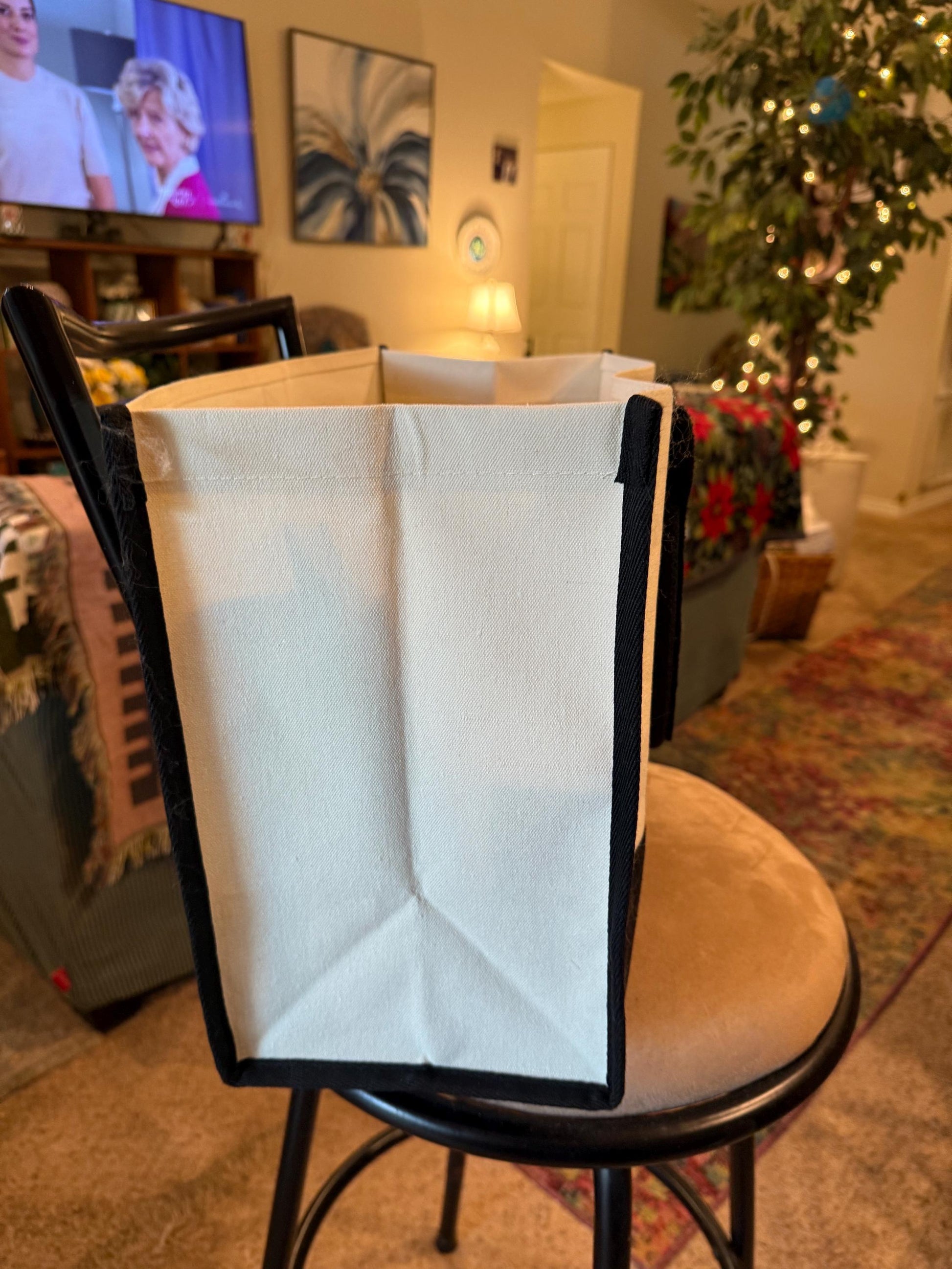Large white and red custom canvas bag with handles, featuring a bold color block design and personalized details.