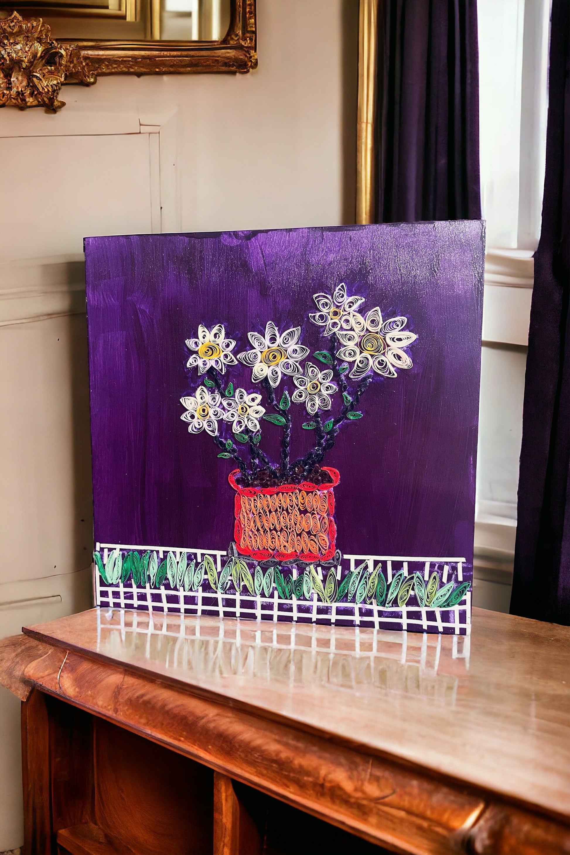 Original paper quilling artwork of a flower pot, showcasing intricate paper coil designs on a white background.