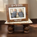 Vintage hand-carved wooden pedestal stand with intricate design, ideal for displaying decorative items or artwork.