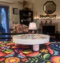 White rainbow mosaic plant stand with handcrafted details, perfect for displaying potted plants in a stylish home decor setting.
