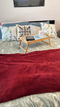 Luxury bamboo bed tray with mosaic inlay, featuring a sleek rectangular design and handles for convenient serving.