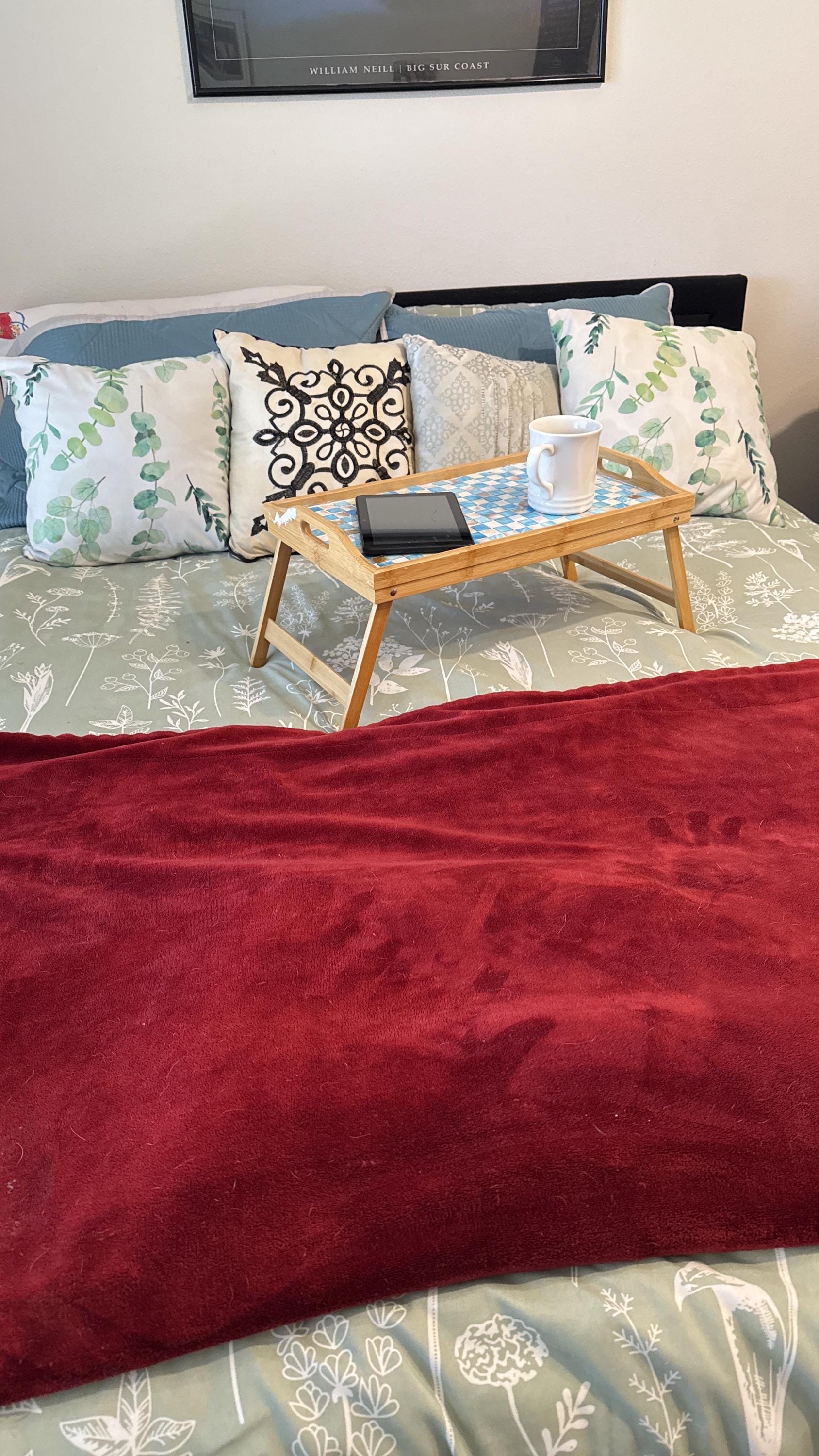 Luxury bamboo bed tray with mosaic inlay, featuring a sleek rectangular design and handles for convenient serving.