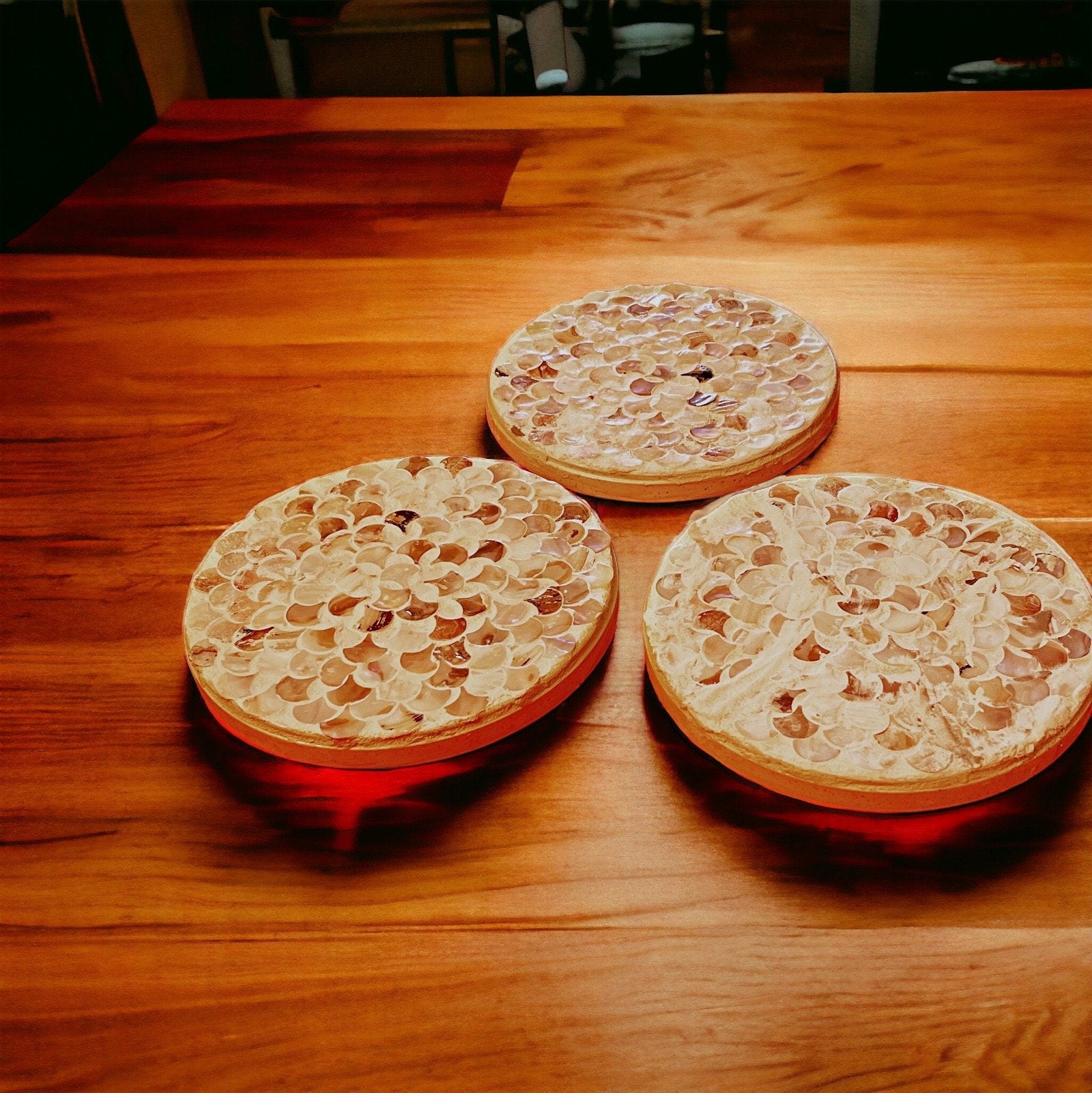 Handmade mother of pearl scallop mosaic decorative stand with intricate shell pattern and elegant design.