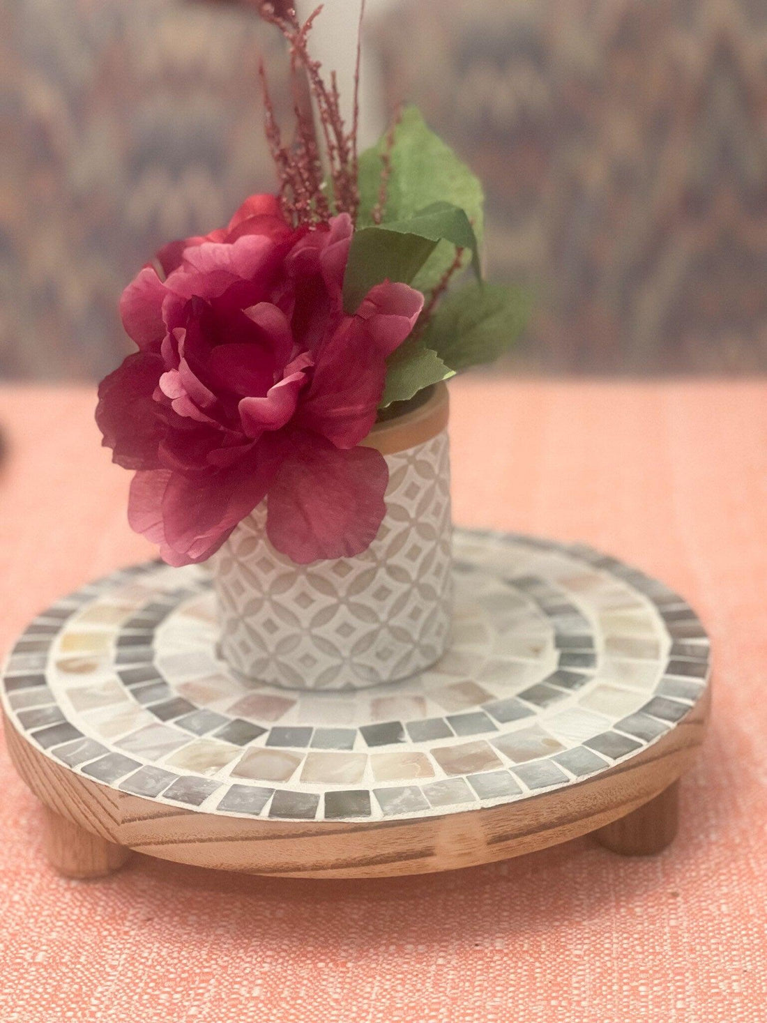 Handcrafted wooden mosaic plant stand with colorful tile design, perfect for indoor or outdoor plant displays.