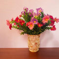Handcrafted scalloped Capiz shell mosaic vase with a smooth, rounded design and intricate shell patterns.