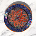 Handcrafted round mosaic wall art featuring colorful glass tiles, ideal for decorative home wall decor.