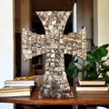 Mother of Pearl mosaic cross with intricate design, featuring iridescent pearl tiles on a religious cross.