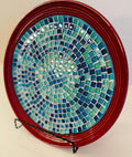 Deep crimson ceramic plate featuring an Ocean Breeze mosaic pattern with vibrant blue and white ocean-inspired designs.