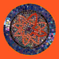 Handcrafted round mosaic wall art featuring colorful glass tiles, perfect for decorative home wall accents.