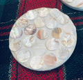 Mother of Pearl mosaic coaster set featuring elegant, iridescent tiles arranged in a decorative pattern for home decor.
