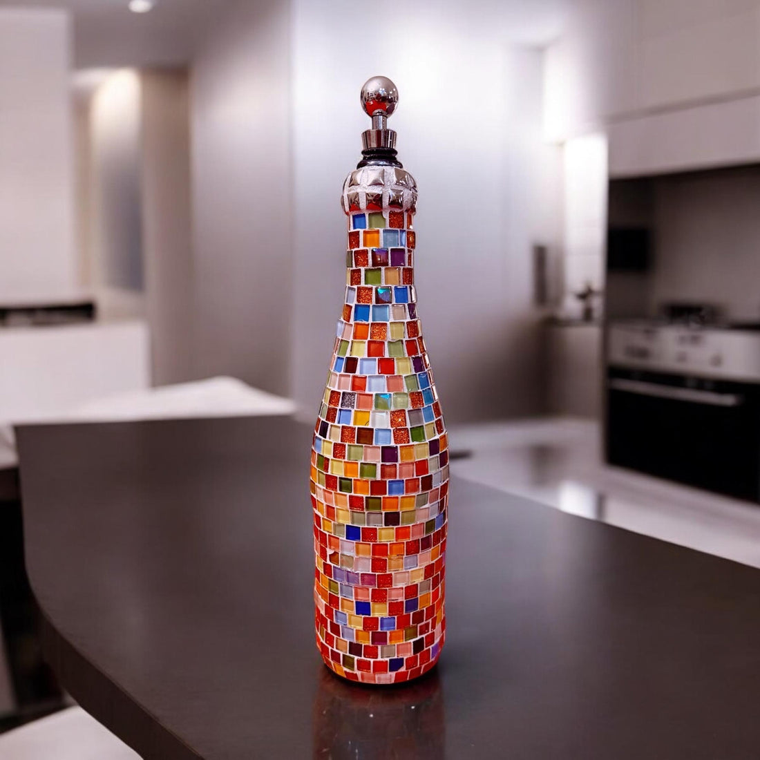 Multicolored mosaic wine decanter with artistic glass design, featuring a sleek shape and vibrant patterns for elegant wine serving.