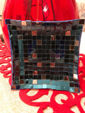 Handcrafted mosaic mirror glass dish featuring colorful, reflective tiles arranged in an intricate pattern, ideal for decorative use.