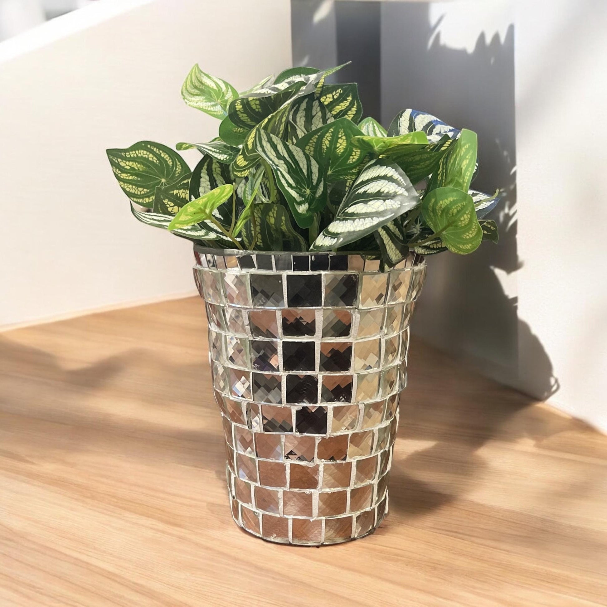 Artificial snake plant in a silver mosaic planter with lush green leaves, designed by Miss Bette's Creations