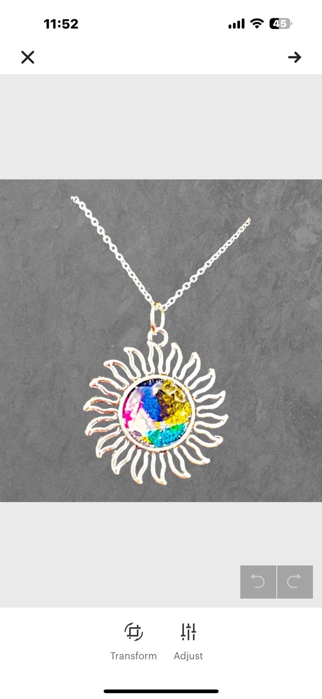Multicolored glass sunburst pendant necklace with silver chain, featuring vibrant stained glass design, from My Store.