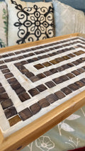 Rustic bamboo bed tray with stone mosaic inlay, showcasing natural wood finish and intricate mosaic design for serving or breakfast.