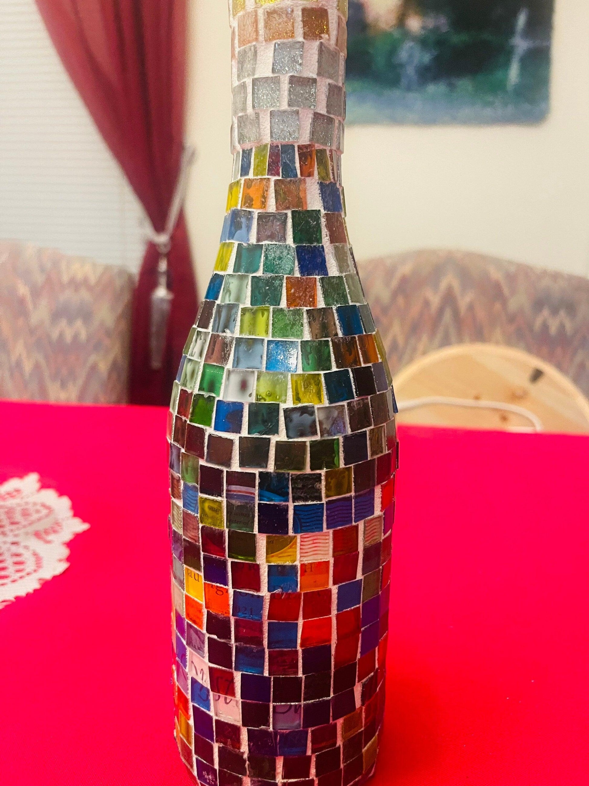 Stained glass look wine decanter with intricate colorful glass design, elegant pour spout, and decorative finish.