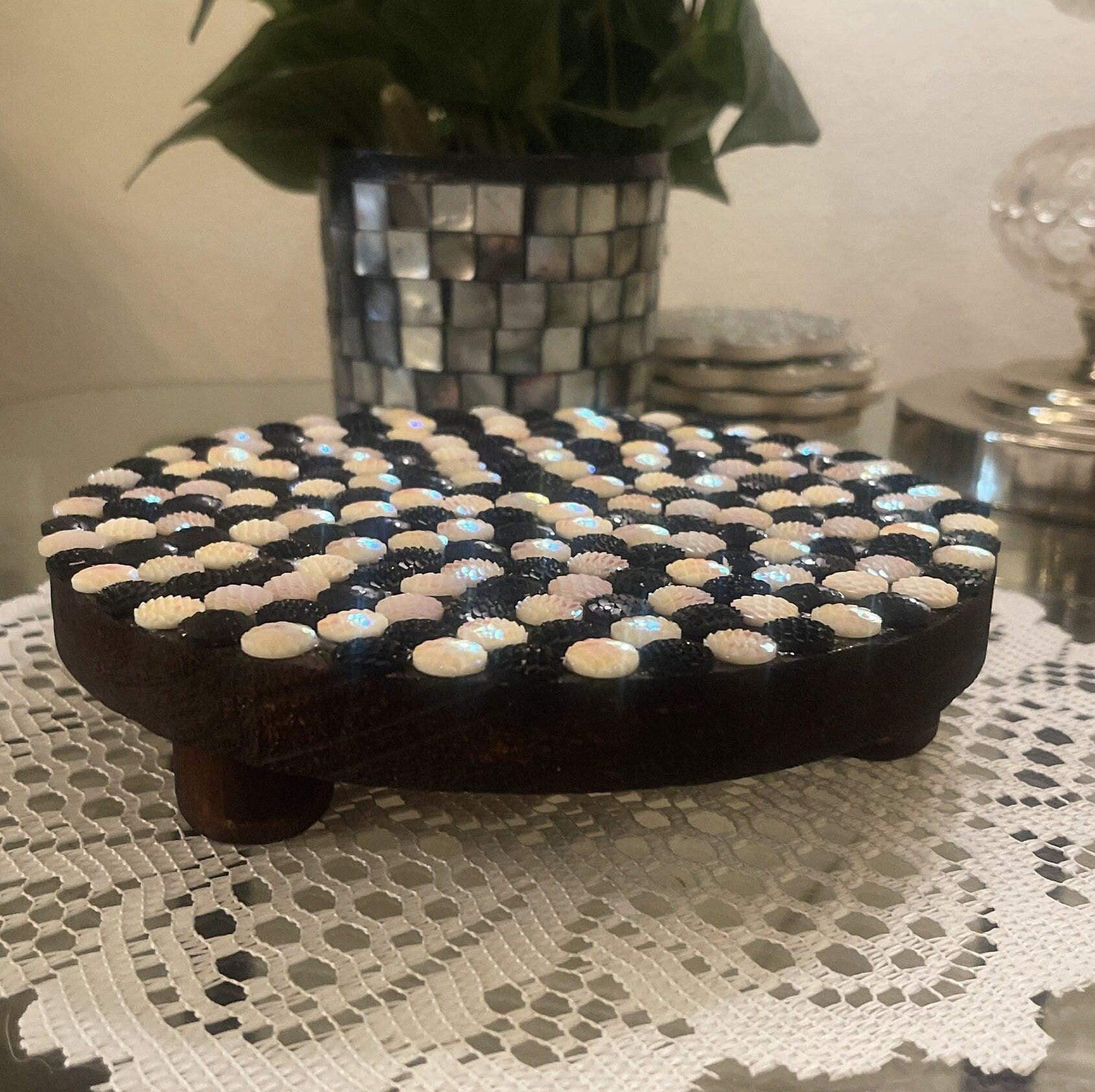 Handmade black and white iridescent mosaic plant stand with a round top and decorative base, perfect for indoor plants.