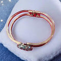 Deep blue glass cuff bracelet with smooth finish, stylish accessory featuring a bold, modern design.