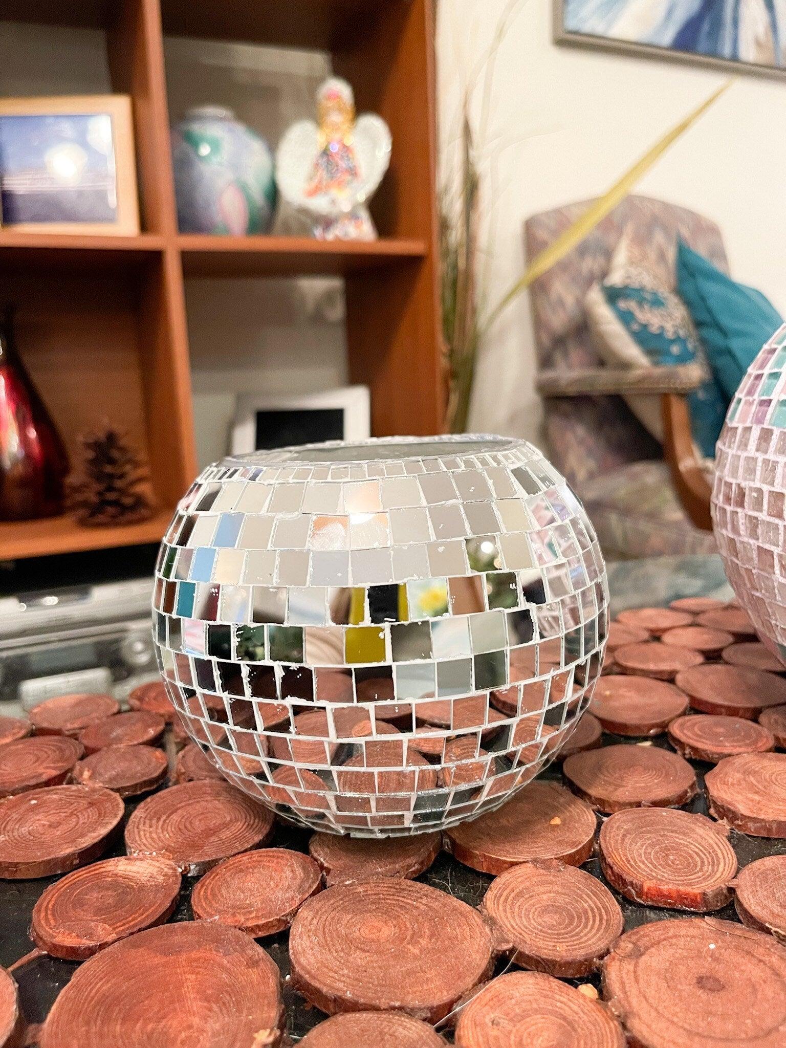 Artisanal mirror disco ball globe vase with reflective surface, decorative home decor item for modern interior styling.
