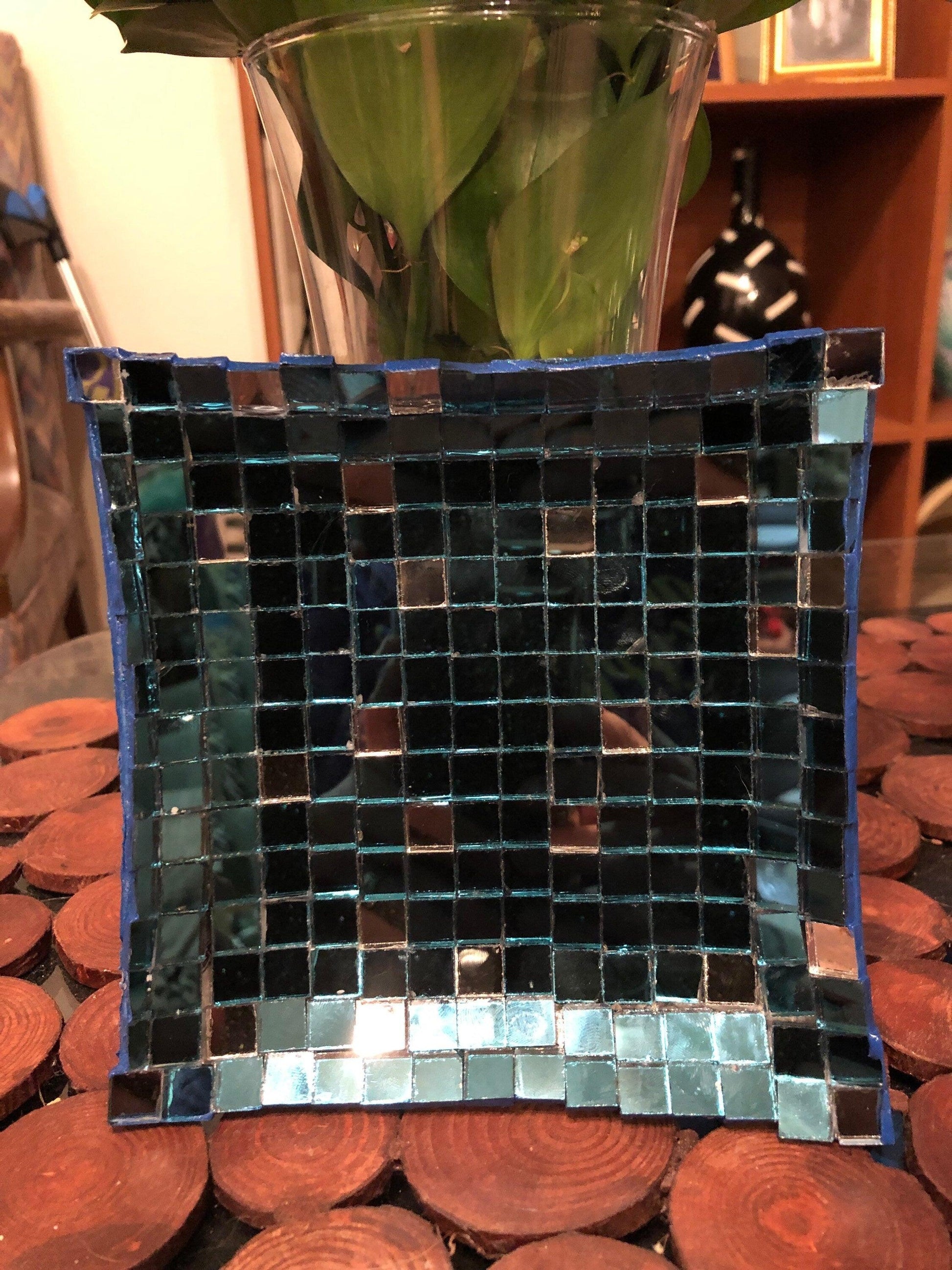 Handcrafted mosaic mirror glass dish with colorful, intricate tile patterns, perfect for decorative display or serving.