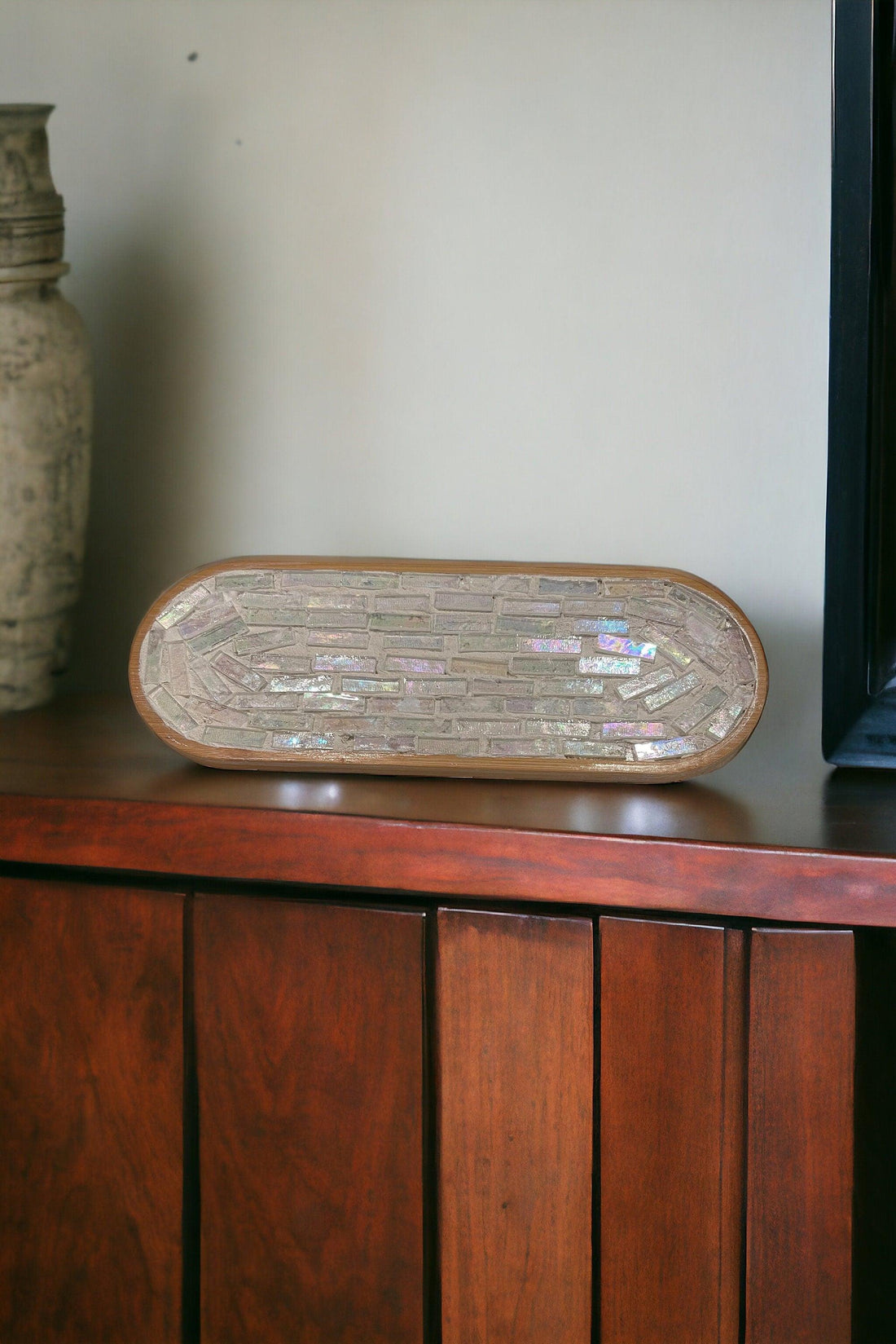 Rose quartz and slate mandala mosaic wall art featuring intricate geometric patterns and vibrant pink and gray tones.