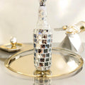 Silver mirrored mosaic wine decanter with a sleek, reflective surface and intricate mosaic design, perfect for elegant wine serving.