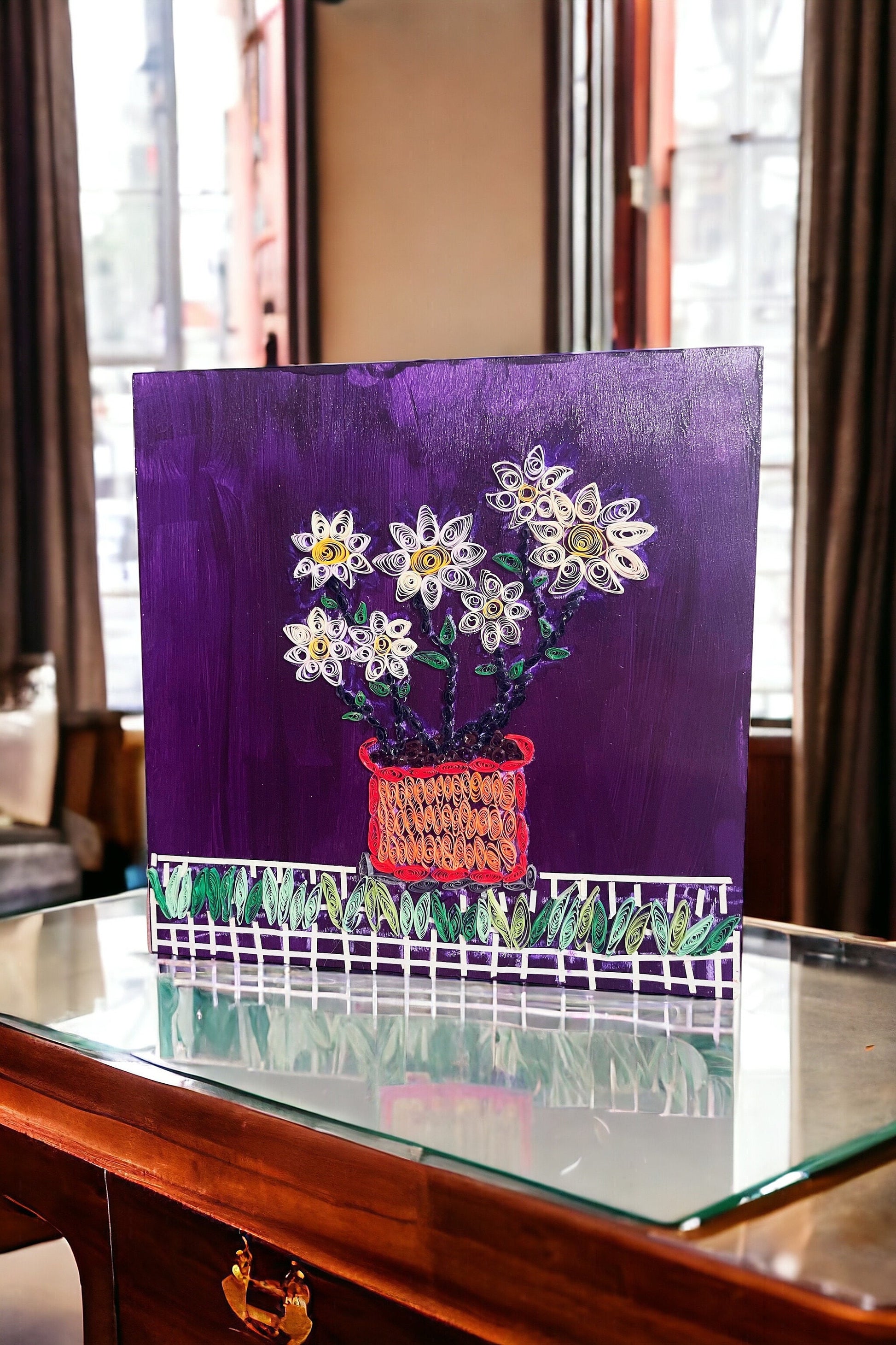Original paper quilling artwork of a flower pot, showcasing intricate paper coil designs and vibrant colors.