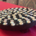 Handmade black and white iridescent mosaic plant stand with intricate tile pattern, designed for indoor or outdoor use
