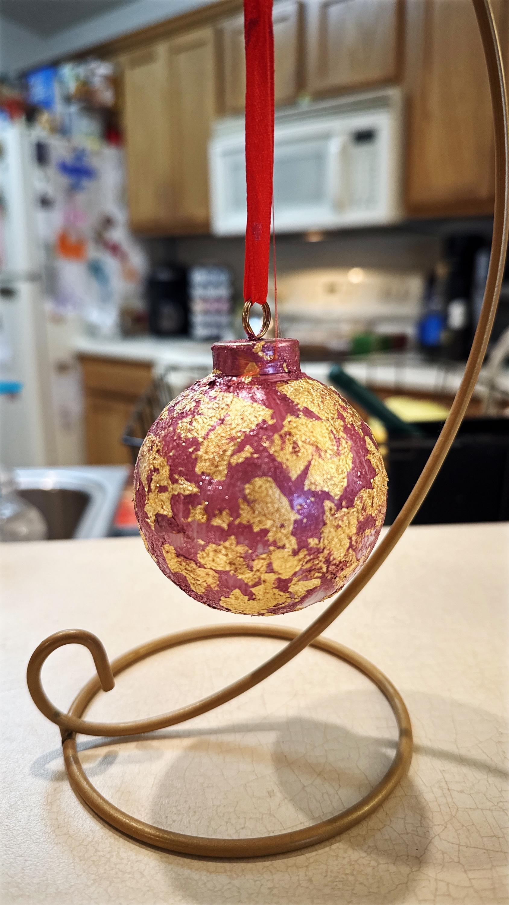 Rose and gold leaf Christmas ornament with intricate design, perfect for holiday decor and festive tree decorations.