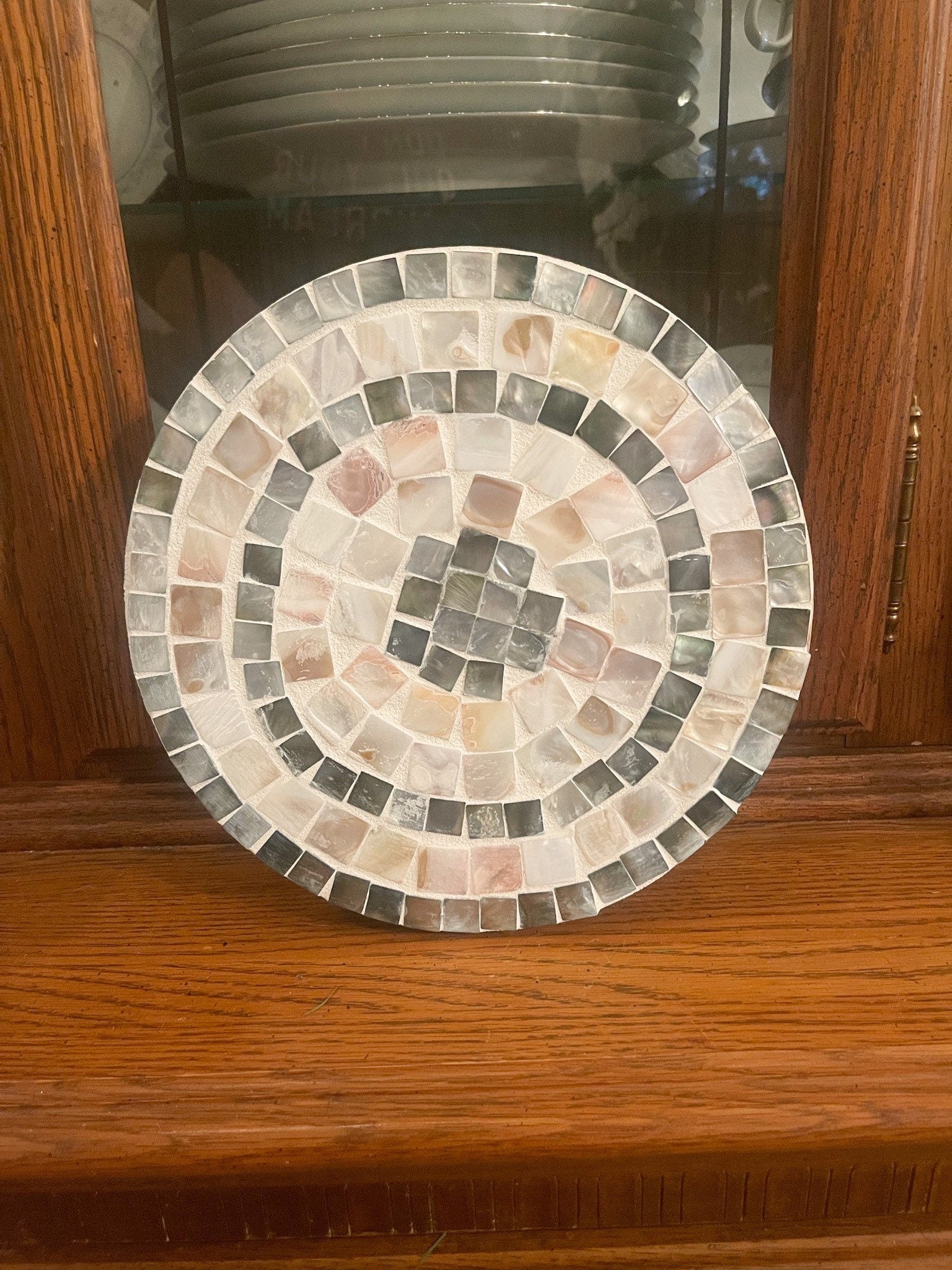 Handcrafted wooden mosaic plant stand with colorful tile design from Miss Bette's Creations, showing detailed mosaic pattern and sturdy construction.